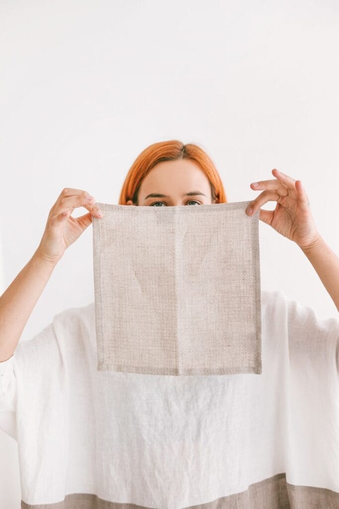 Lightweight linen hand towel in waffle texture perfect for travel or guest bathrooms.